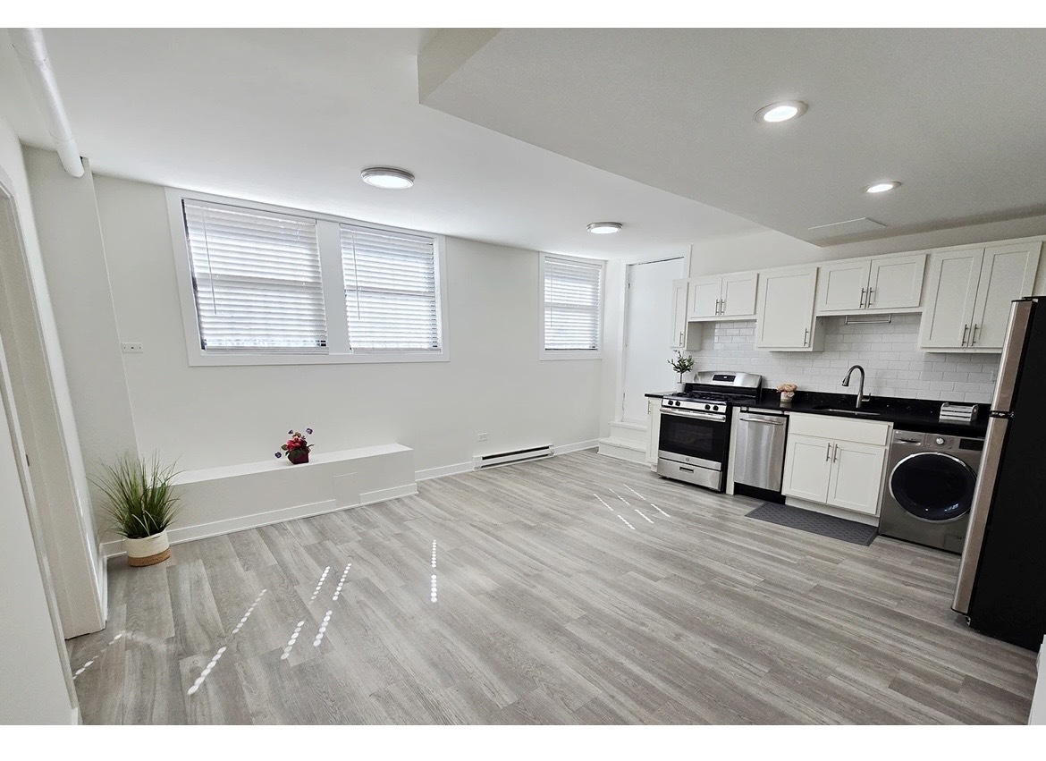 732 West Roscoe Street, Unit SGA Chicago, IL 60657 - Photo 5 of 13 a view of kitchen with wooden floor