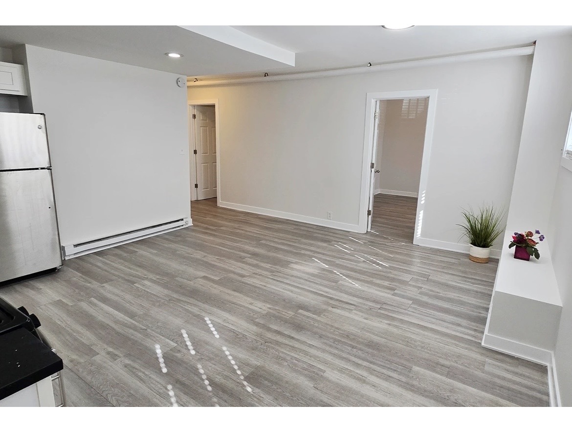 732 West Roscoe Street, Unit SGA Chicago, IL 60657 - Photo 7 of 13 wooden floor in an empty room
