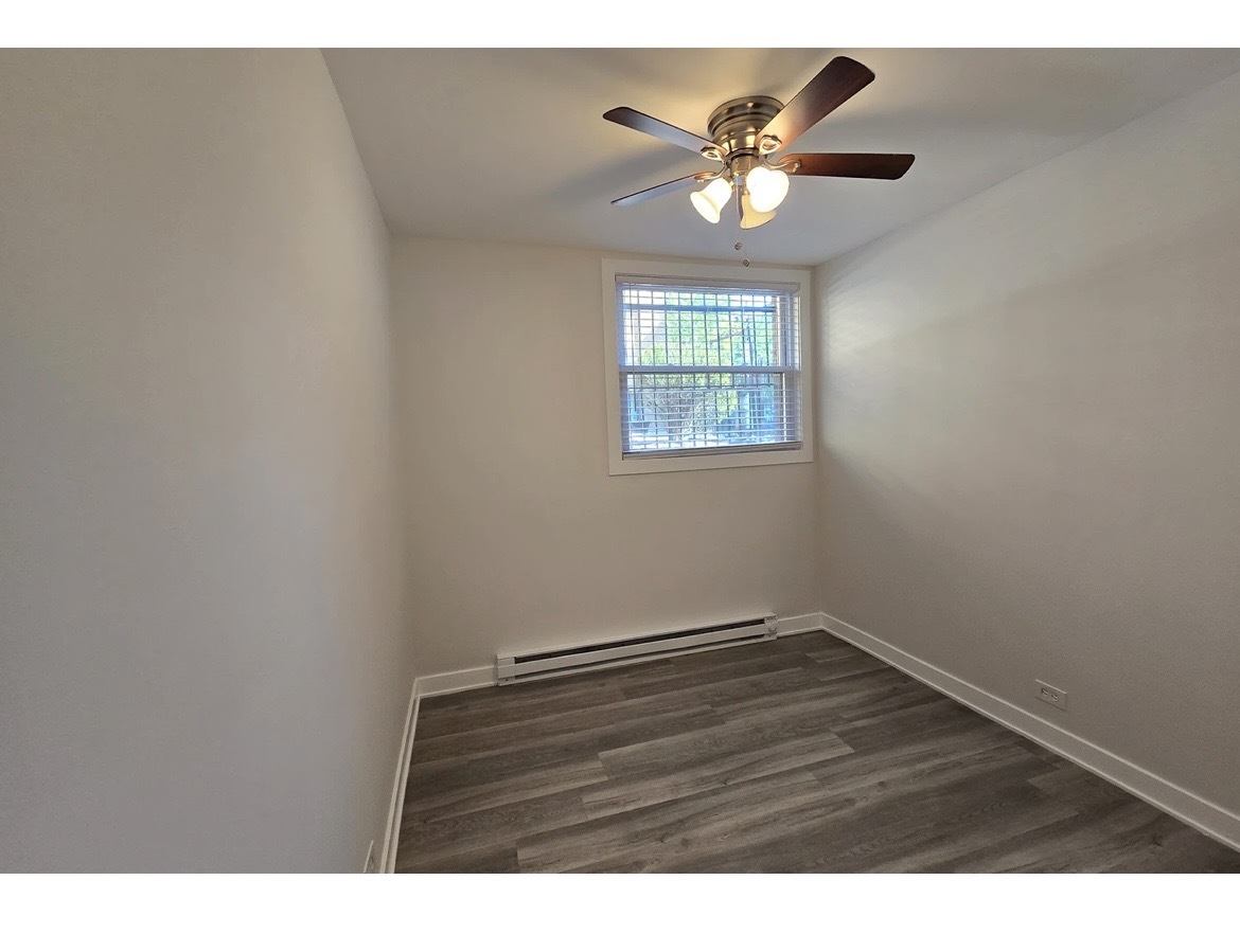 732 West Roscoe Street, Unit SGA Chicago, IL 60657 - Photo 10 of 13 a view of an empty room with a window