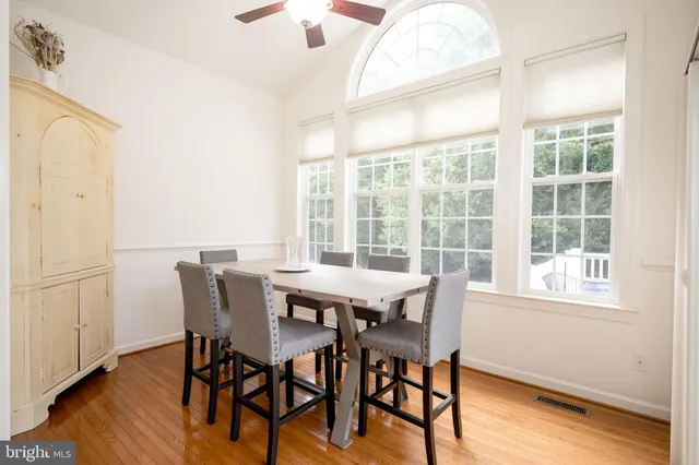 a bathroom with a toilet a sink and a mirror