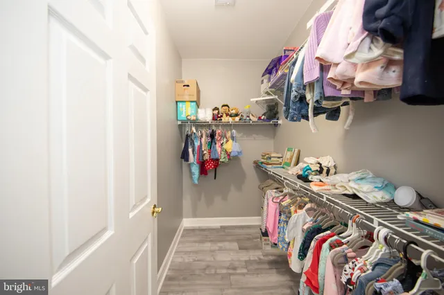 a bed room with a bed mirror and a window