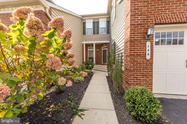 a entryway with flower plants
