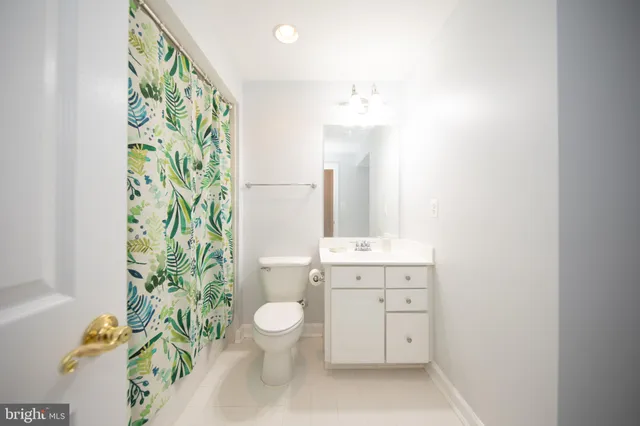 a view of a balcony with wooden floor and windows