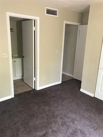 a view of a room with closet and wooden floor