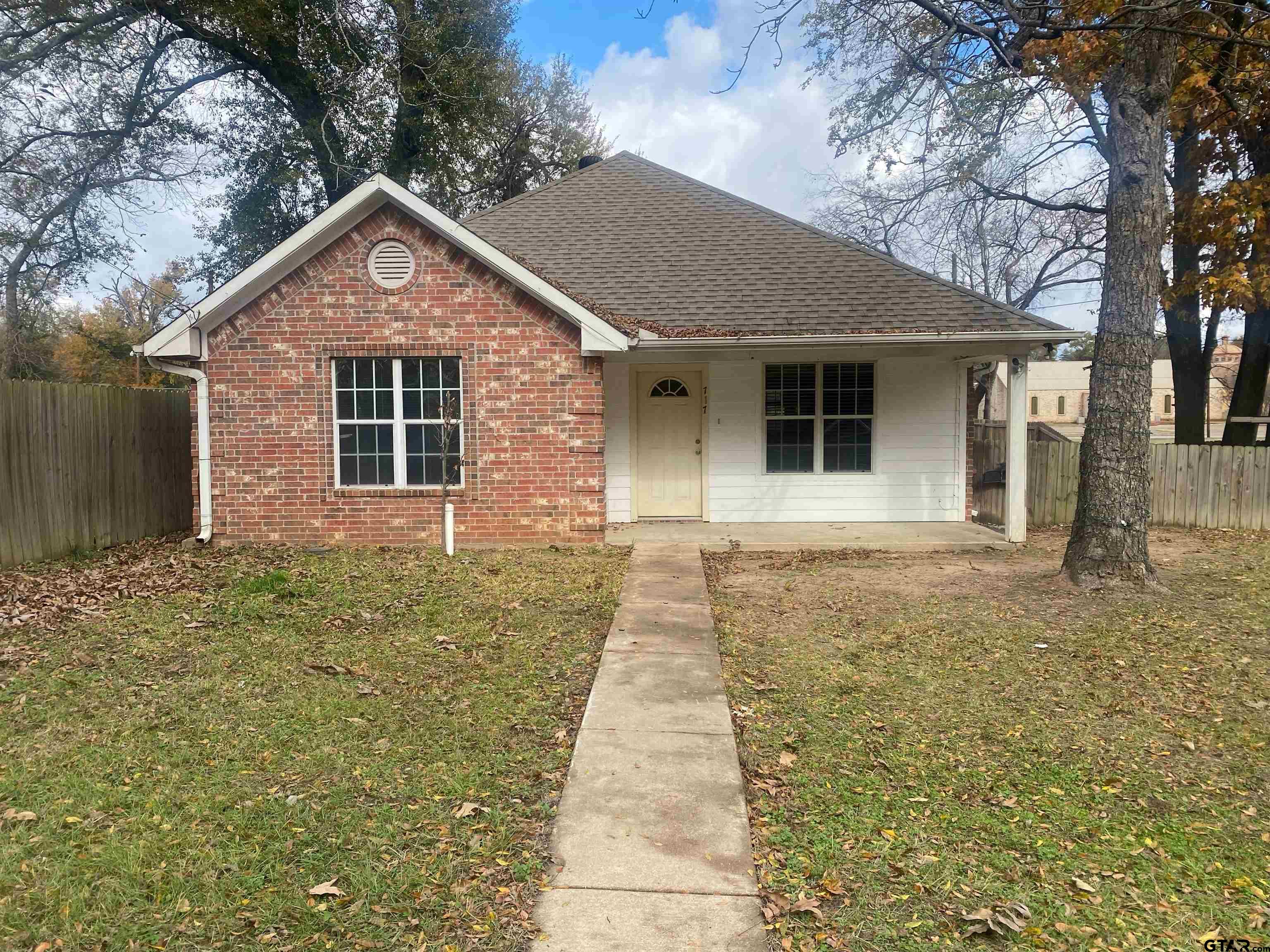 front view of a house with a yard