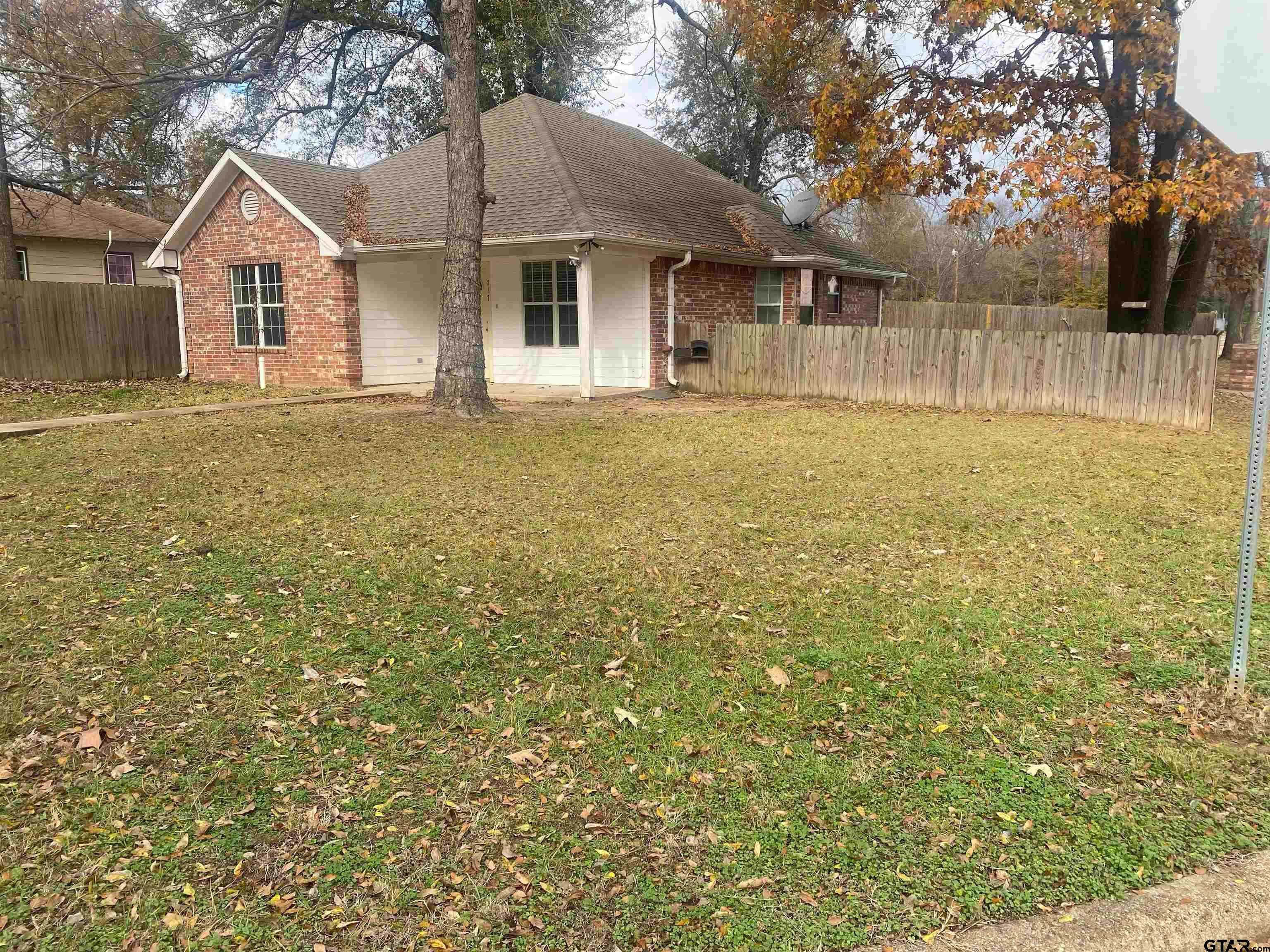 717 West Morris Street Tyler, TX 75702 - Photo 2 of 18 a front view of a house with garden