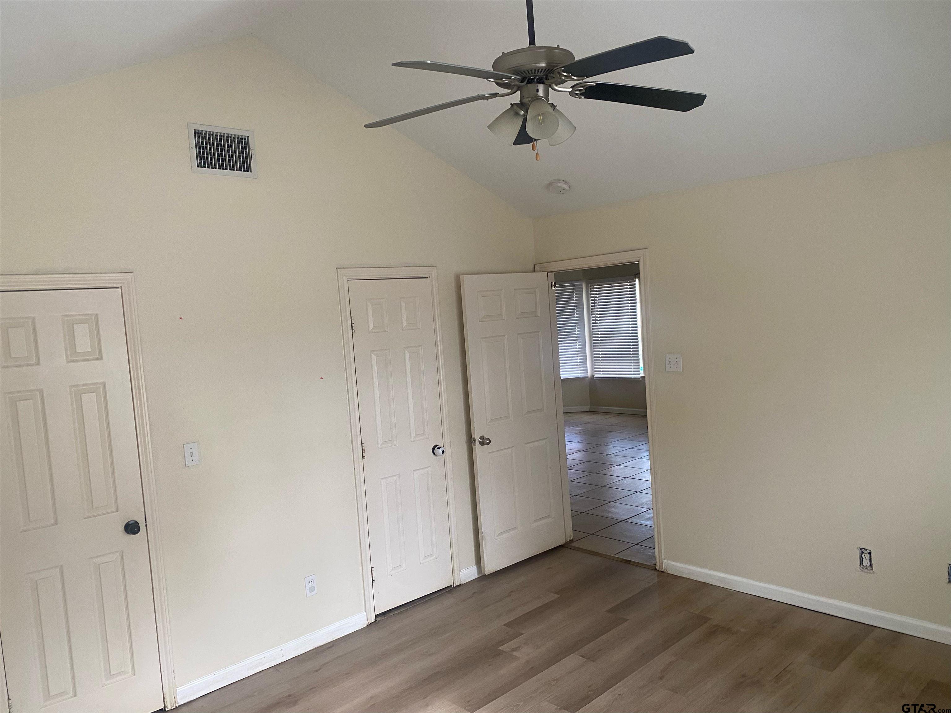 717 West Morris Street Tyler, TX 75702 - Photo 9 of 18 a view of an empty room with wooden floor