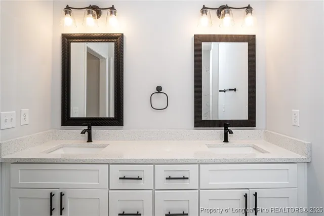 a bathroom with mirror sink and vanity