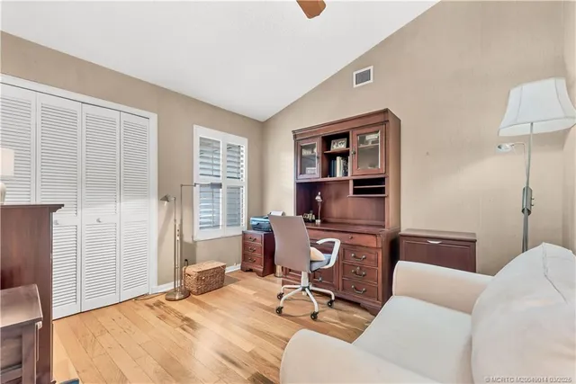 a view of a livingroom with workspace and a couch