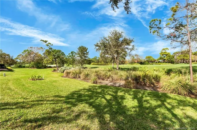 a view of a lake with a big yard