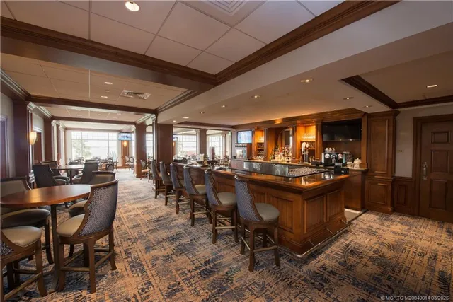 a room with lots of tables a dining table and chairs