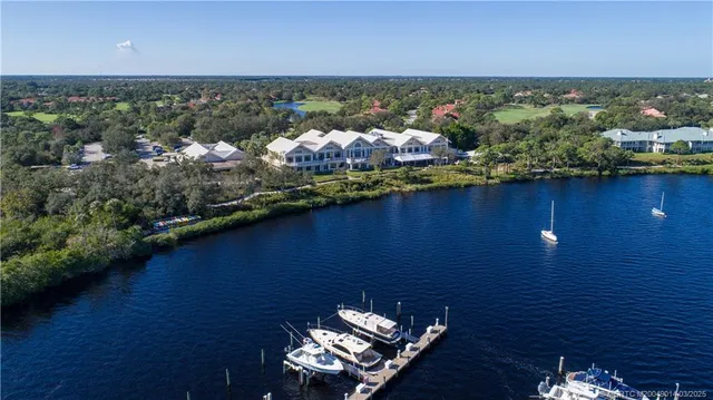 an aerial view of a house with a lake view