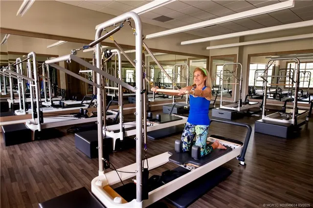 a view of a living room with furniture and wooden floor