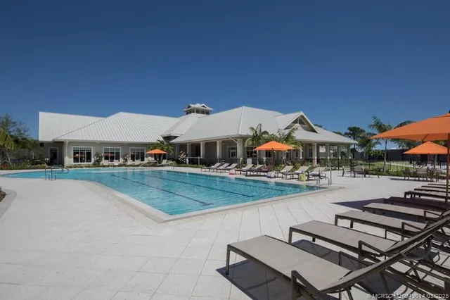 a view of a gym room with gym equipment