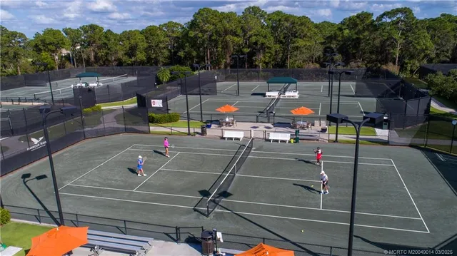a view of a house with a tree