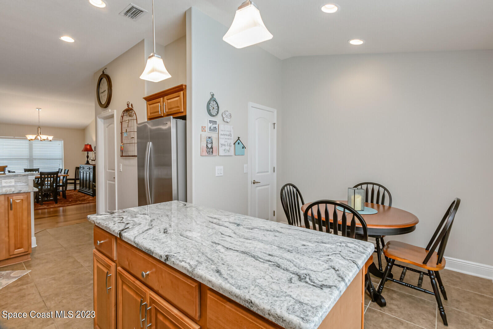 1569 Oconner Avenue Melbourne, FL 32940 - Photo 11 of 37 a kitchen with sink and refrigerator