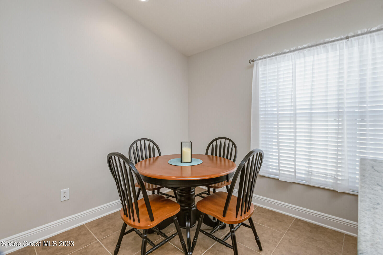 1569 Oconner Avenue Melbourne, FL 32940 - Photo 12 of 37 a view of a dining room with furniture and window