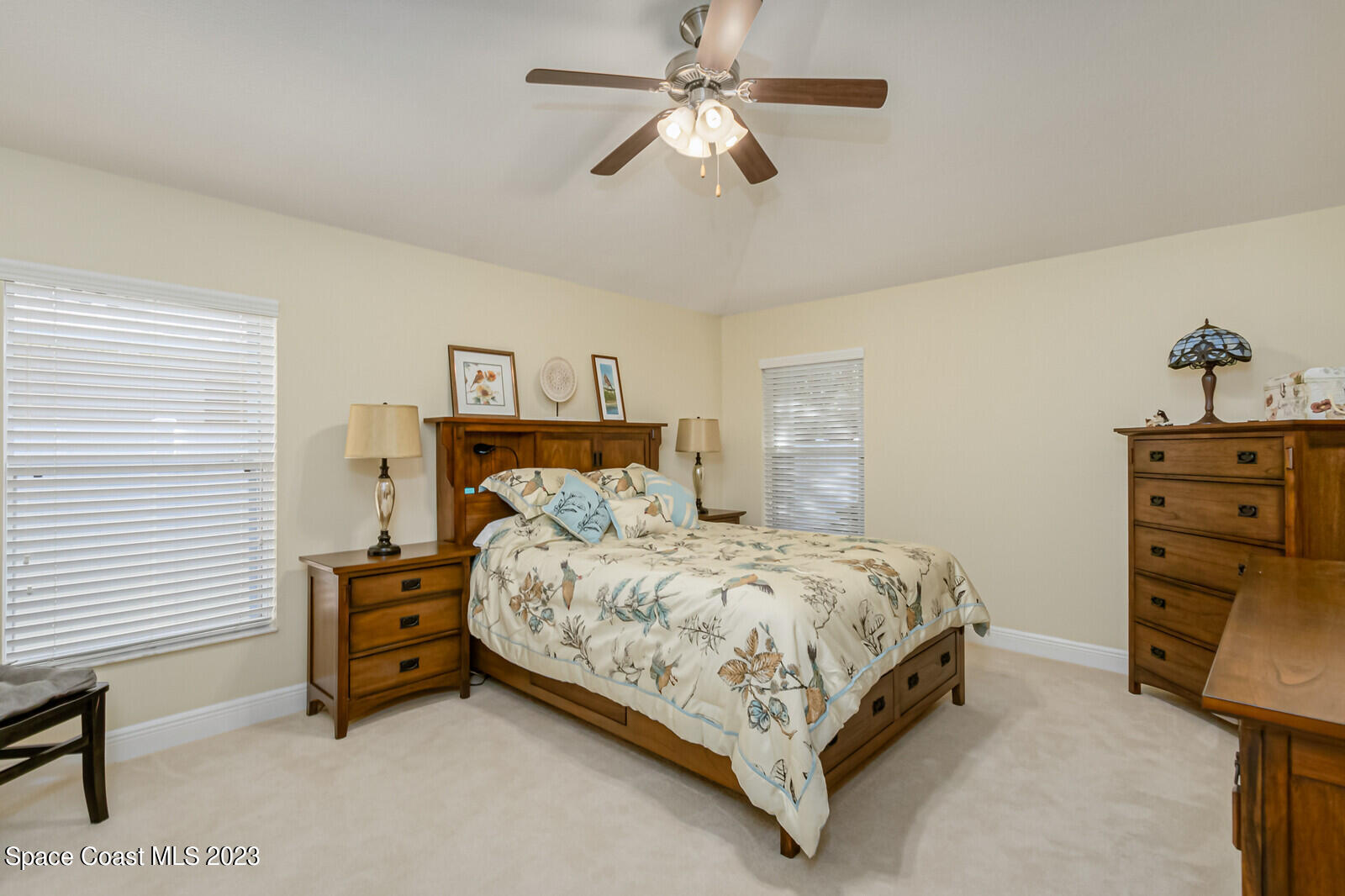 1569 Oconner Avenue Melbourne, FL 32940 - Photo 13 of 37 a bedroom with a bed dresser and a window