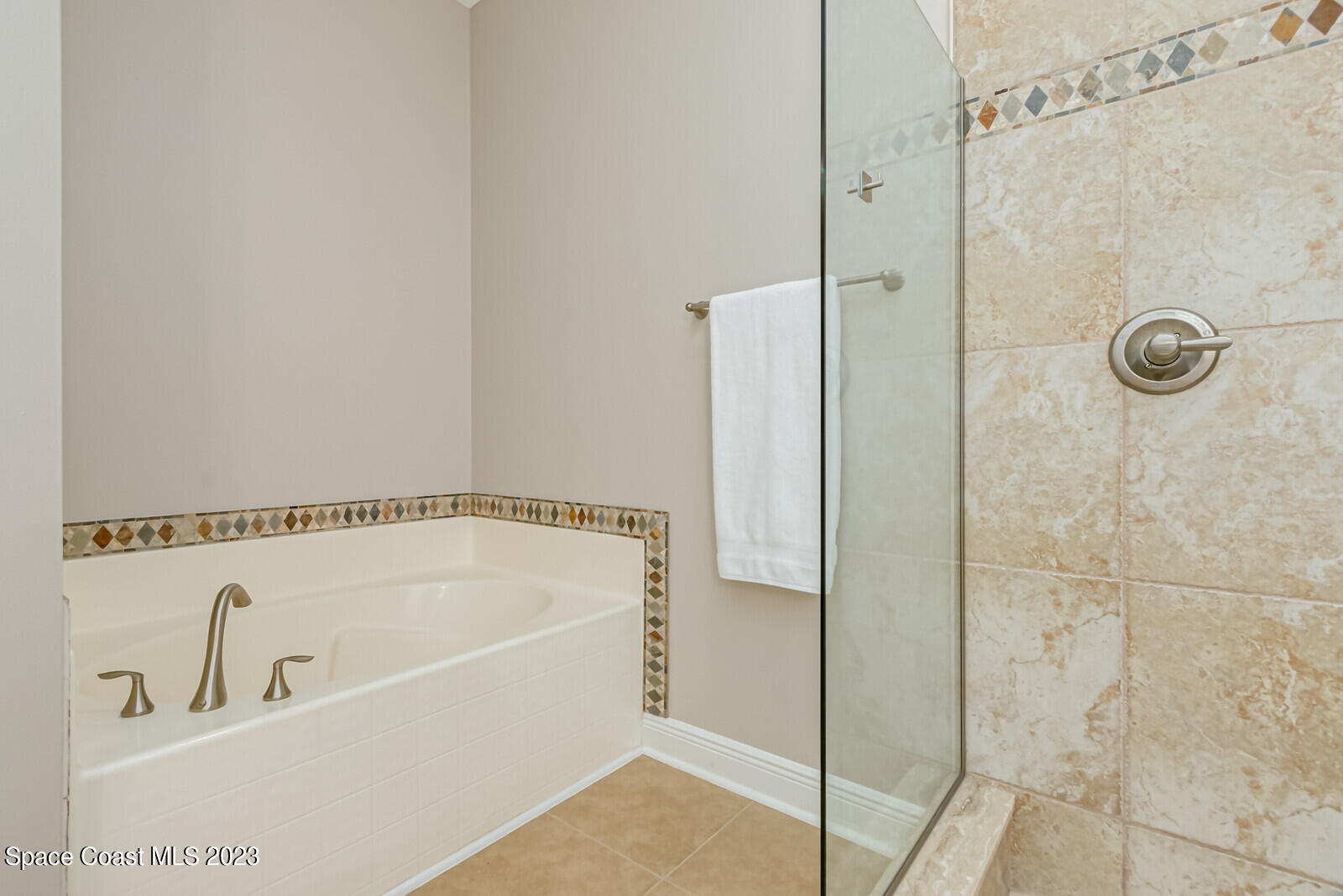1569 Oconner Avenue Melbourne, FL 32940 - Photo 16 of 37 a bathroom with a shower and a bath tub