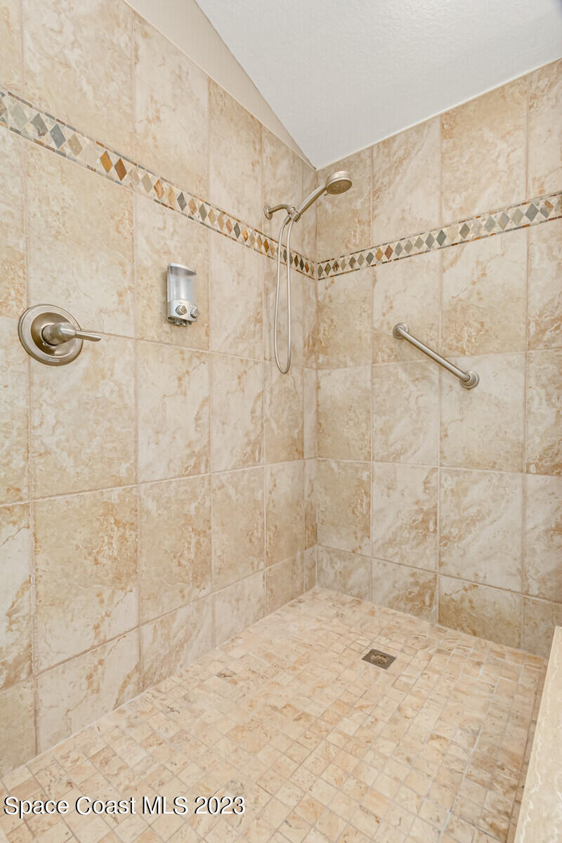 1569 Oconner Avenue Melbourne, FL 32940 - Photo 17 of 37 a bathroom with a shower