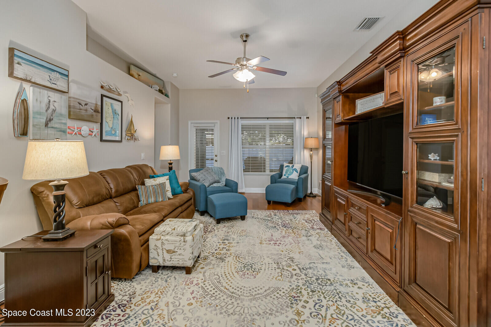1569 Oconner Avenue Melbourne, FL 32940 - Photo 5 of 37 a living room with furniture and a flat screen tv