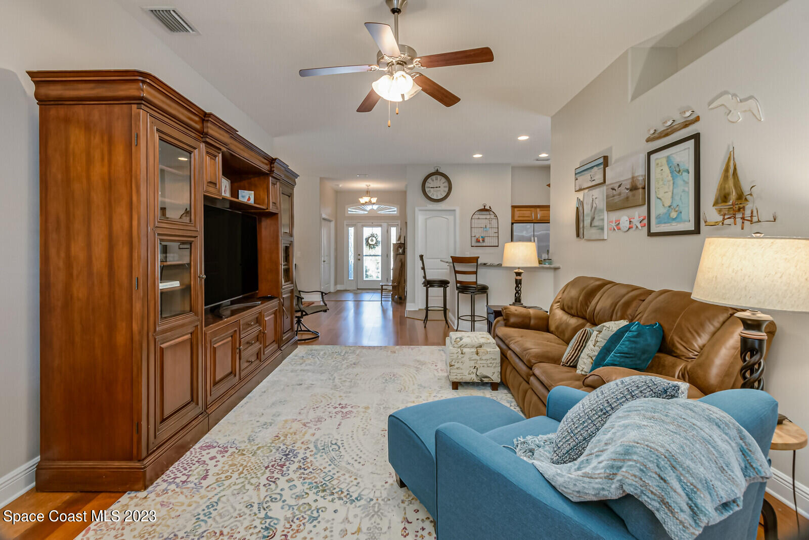 1569 Oconner Avenue Melbourne, FL 32940 - Photo 6 of 37 a living room with furniture and a flat screen tv