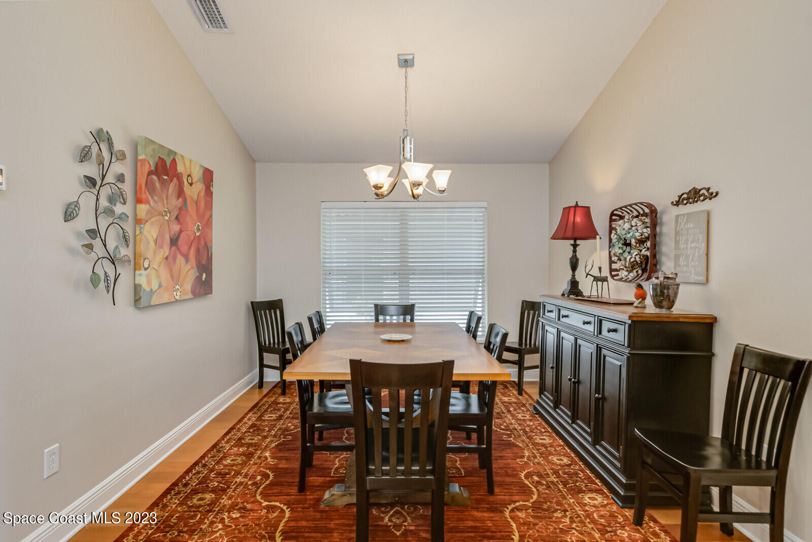 1569 Oconner Avenue Melbourne, FL 32940 - Photo 7 of 37 a view of a dining room with furniture window and wooden floor