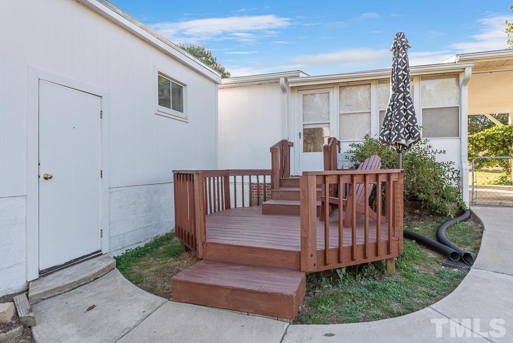 128 Double D Farm Road Angier, NC 27501 - Photo 13 of 29 Back deck and storm cellar entrance