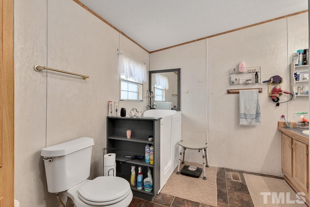 128 Double D Farm Road Angier, NC 27501 - Photo 26 of 29 Ensuite bath with walk-in tub