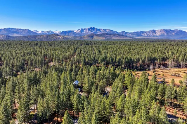 a view of a town with mountains in the background