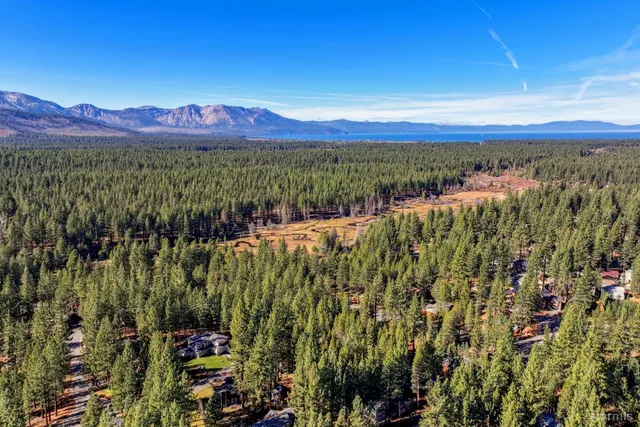 a view of a town with mountains in the background