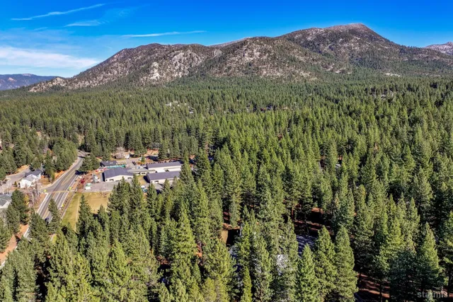 a view of a lush green hillside and a building