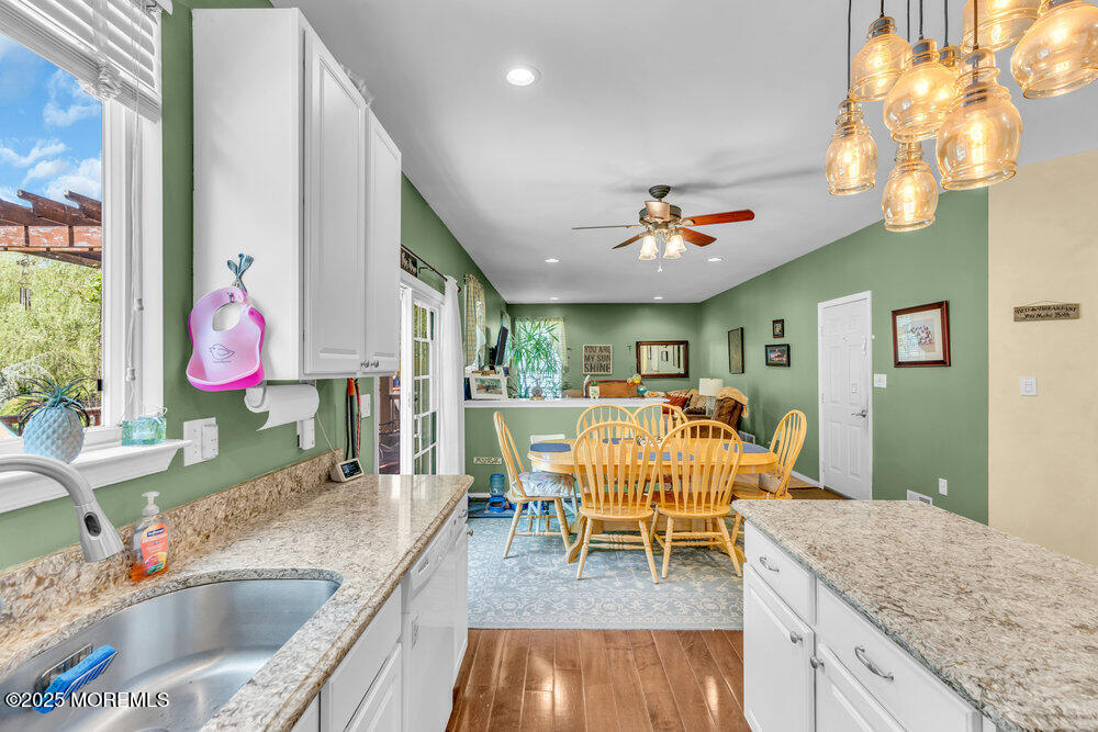 41 Hampshire Boulevard Jackson, NJ 08527 - Photo 11 of 55 a living room with granite countertop kitchen island a table and a sink