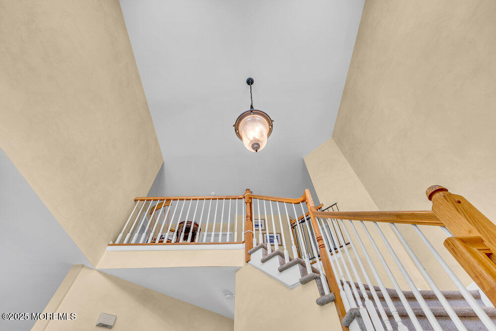 41 Hampshire Boulevard Jackson, NJ 08527 - Photo 19 of 55 a view of a hallway to a house with wooden floor