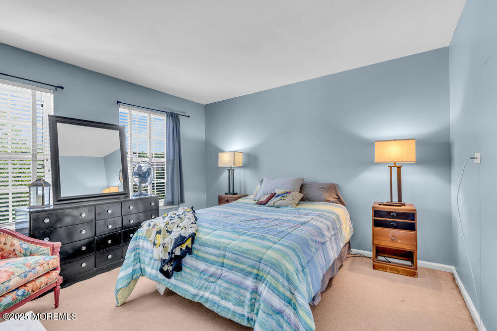 41 Hampshire Boulevard Jackson, NJ 08527 - Photo 21 of 55 a bedroom with a bed and a dresser next to a window