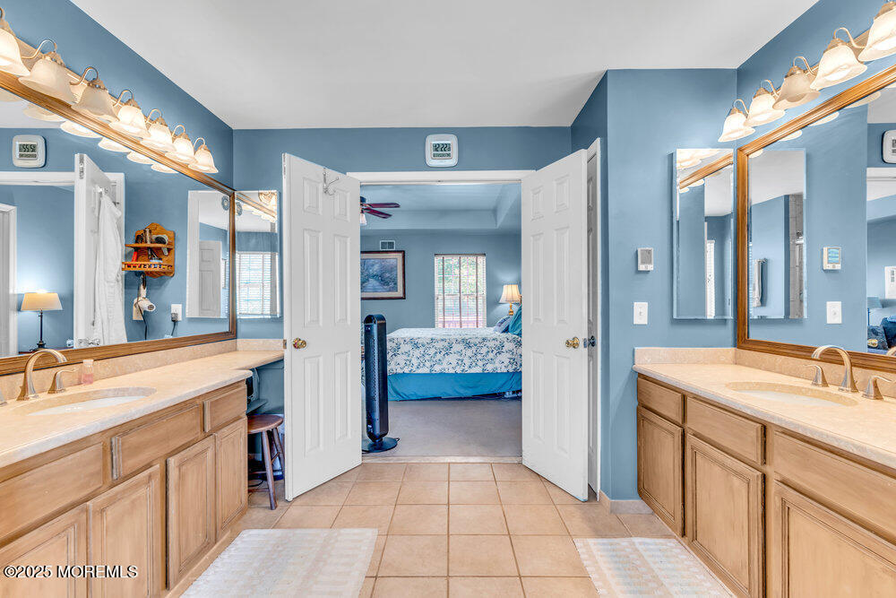 41 Hampshire Boulevard Jackson, NJ 08527 - Photo 27 of 55 a spacious bathroom with a sink a mirror and a shower