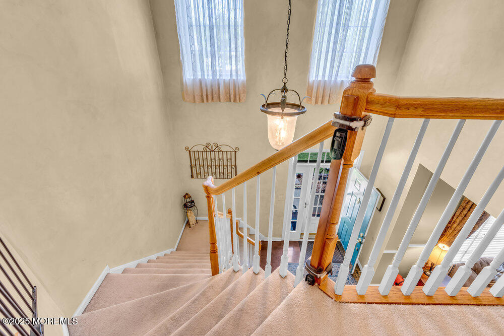 41 Hampshire Boulevard Jackson, NJ 08527 - Photo 31 of 55 a view of staircase with white walls and a window