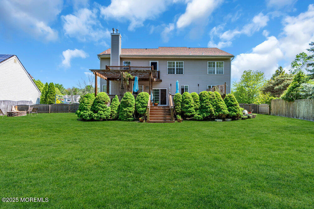 41 Hampshire Boulevard Jackson, NJ 08527 - Photo 35 of 55 a view of a house with brick walls and a yard with plants