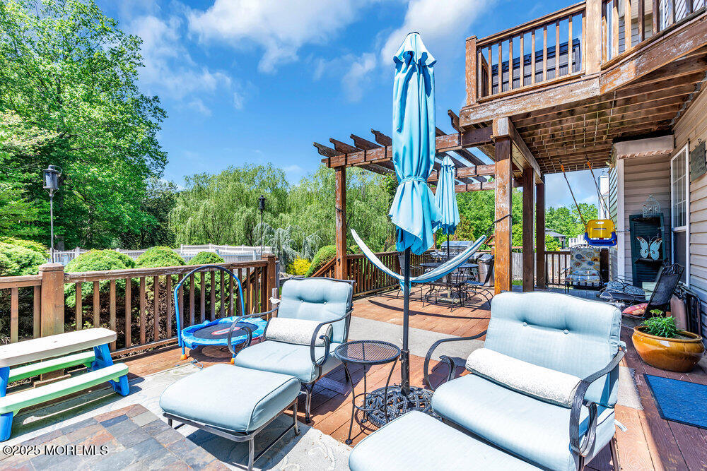 41 Hampshire Boulevard Jackson, NJ 08527 - Photo 42 of 55 a view of a patio with couches chairs and a table