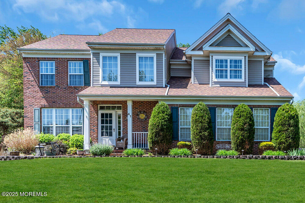 41 Hampshire Boulevard Jackson, NJ 08527 - Photo 48 of 55 a front view of a house with a yard and garden