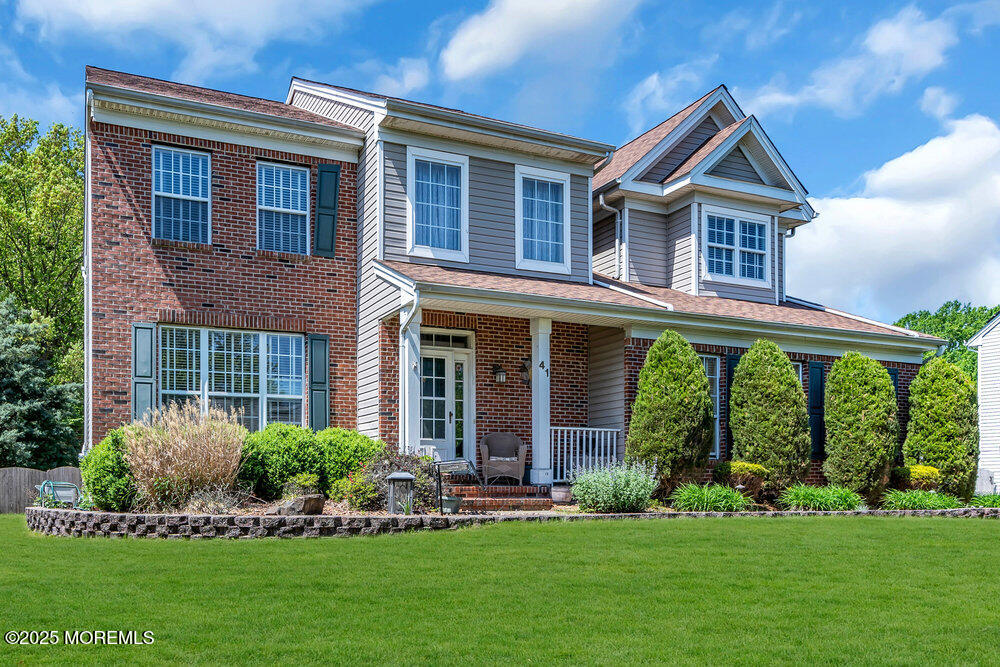 41 Hampshire Boulevard Jackson, NJ 08527 - Photo 49 of 55 a front view of a house with a yard and porch