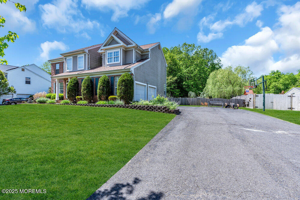 41 Hampshire Boulevard Jackson, NJ 08527 - Photo 52 of 55 a front view of a house with a yard and trees