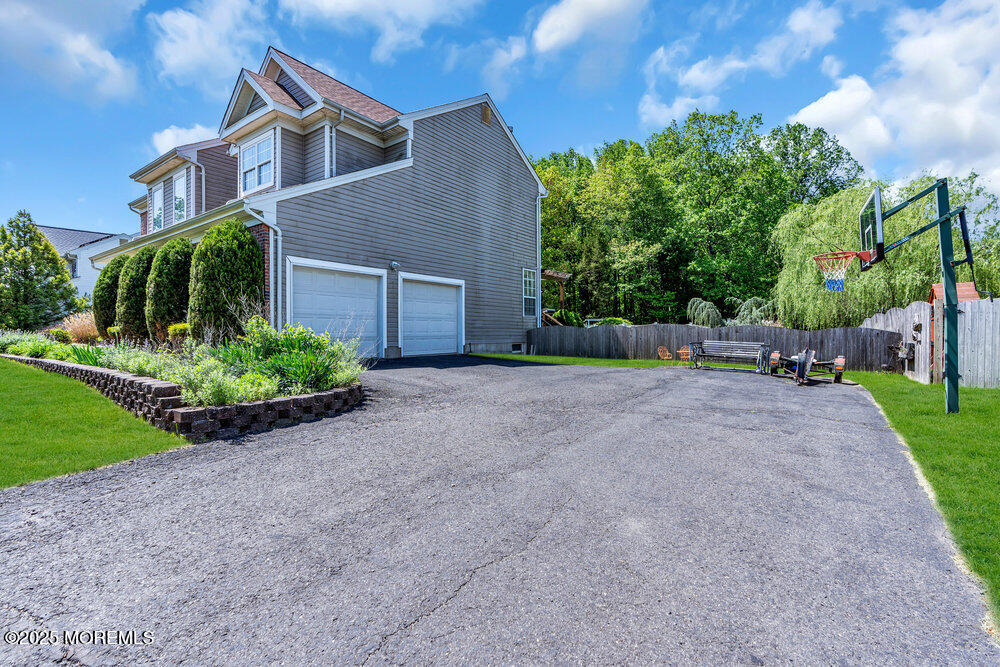 41 Hampshire Boulevard Jackson, NJ 08527 - Photo 53 of 55 a view of a house with a yard and plants