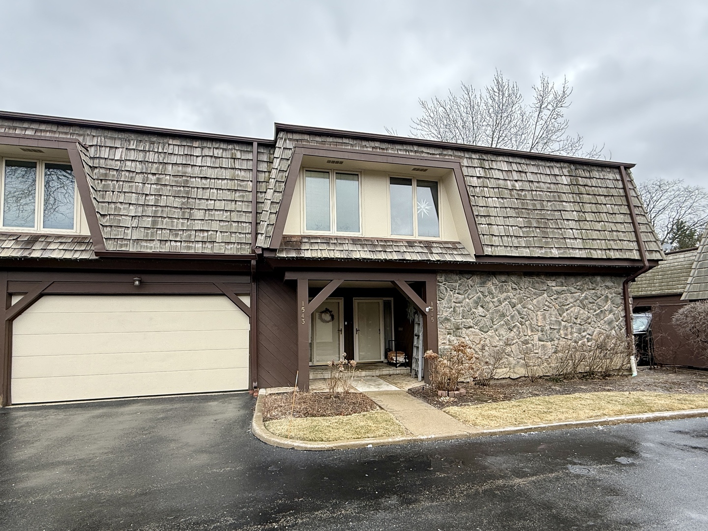 a front view of a house with a garage