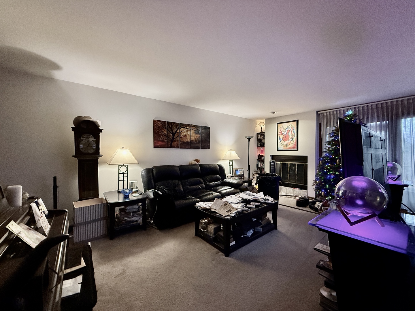 1545 Winnetka Road, Unit 1545 Glenview, IL 60025 - Photo 5 of 14 a living room with furniture a flat screen tv and a fireplace