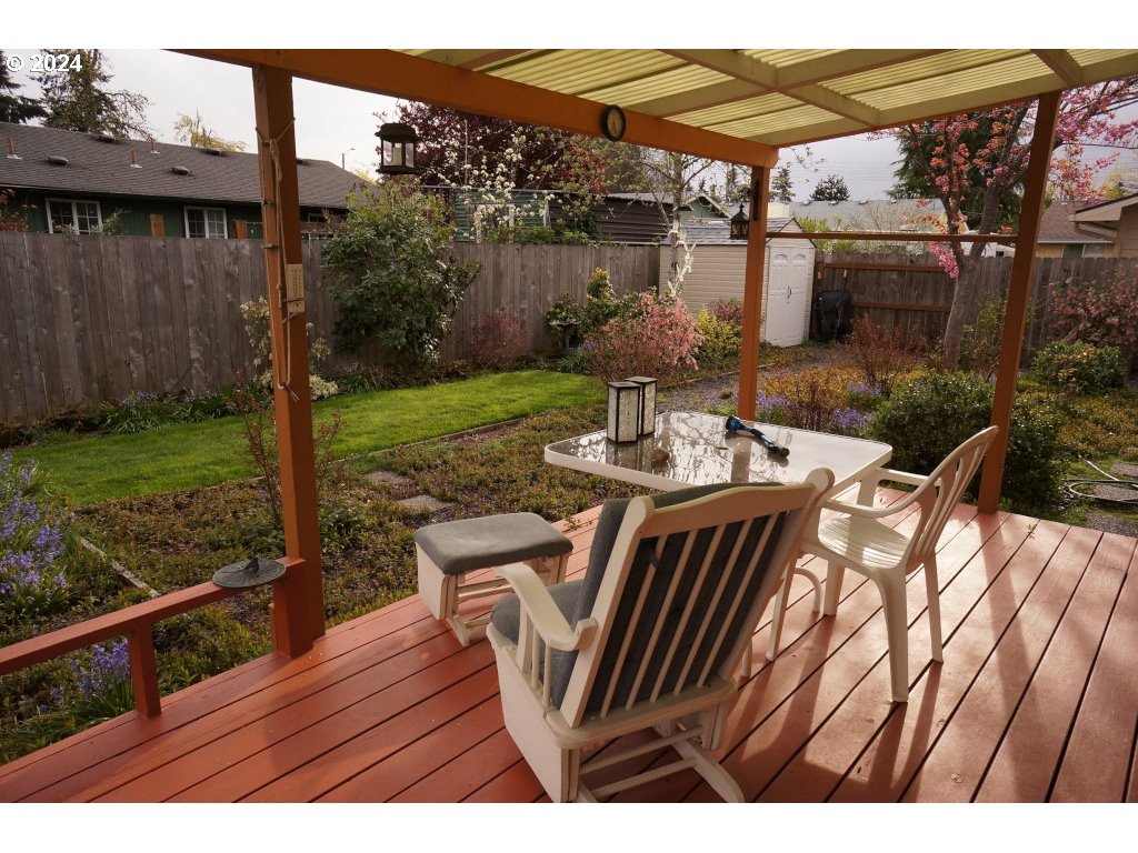 5637 E Street Springfield, OR 97478 - Photo 17 of 27 a view of a patio with table and chairs with wooden floor and fence