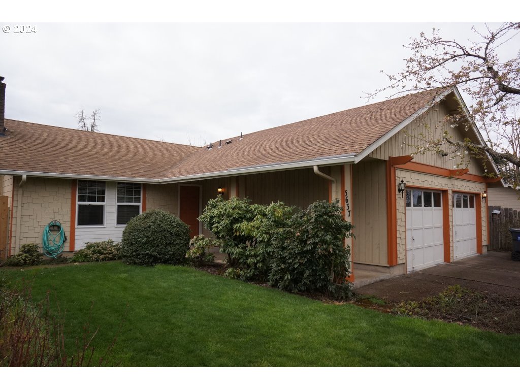 5637 E Street Springfield, OR 97478 - Photo 2 of 27 a front view of house with a garden