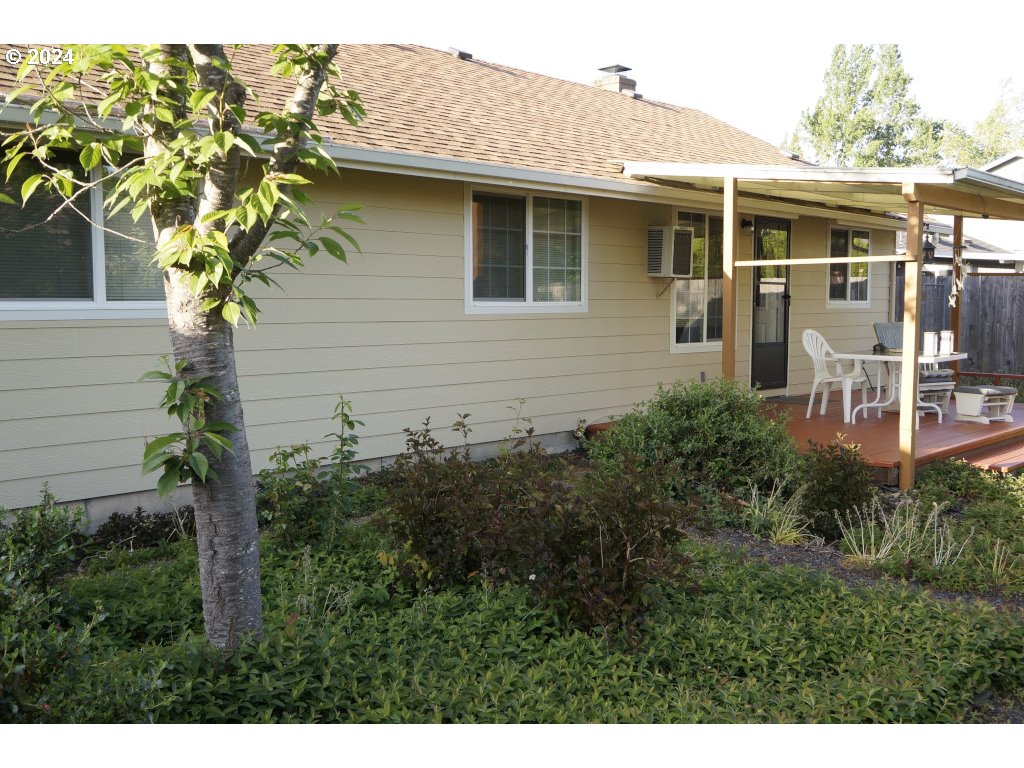 5637 E Street Springfield, OR 97478 - Photo 23 of 27 a backyard of a house with plants and outdoor seating