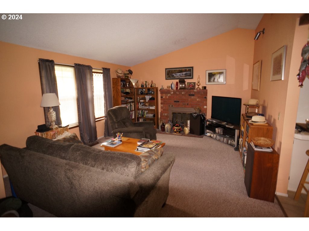 5637 E Street Springfield, OR 97478 - Photo 5 of 27 a living room with furniture and a flat screen tv