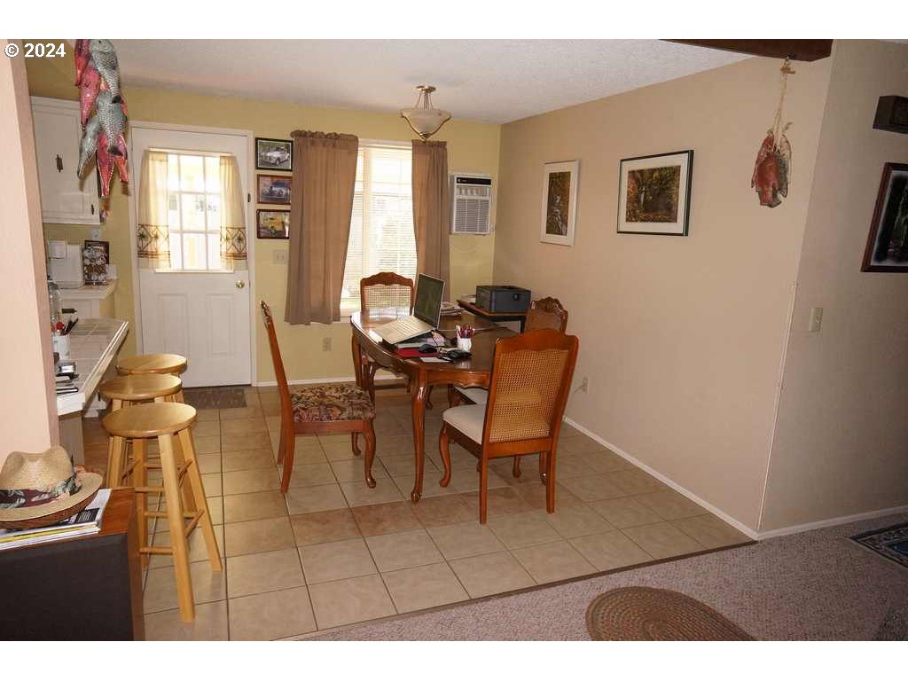 5637 E Street Springfield, OR 97478 - Photo 7 of 27 a view of a livingroom with furniture and a window
